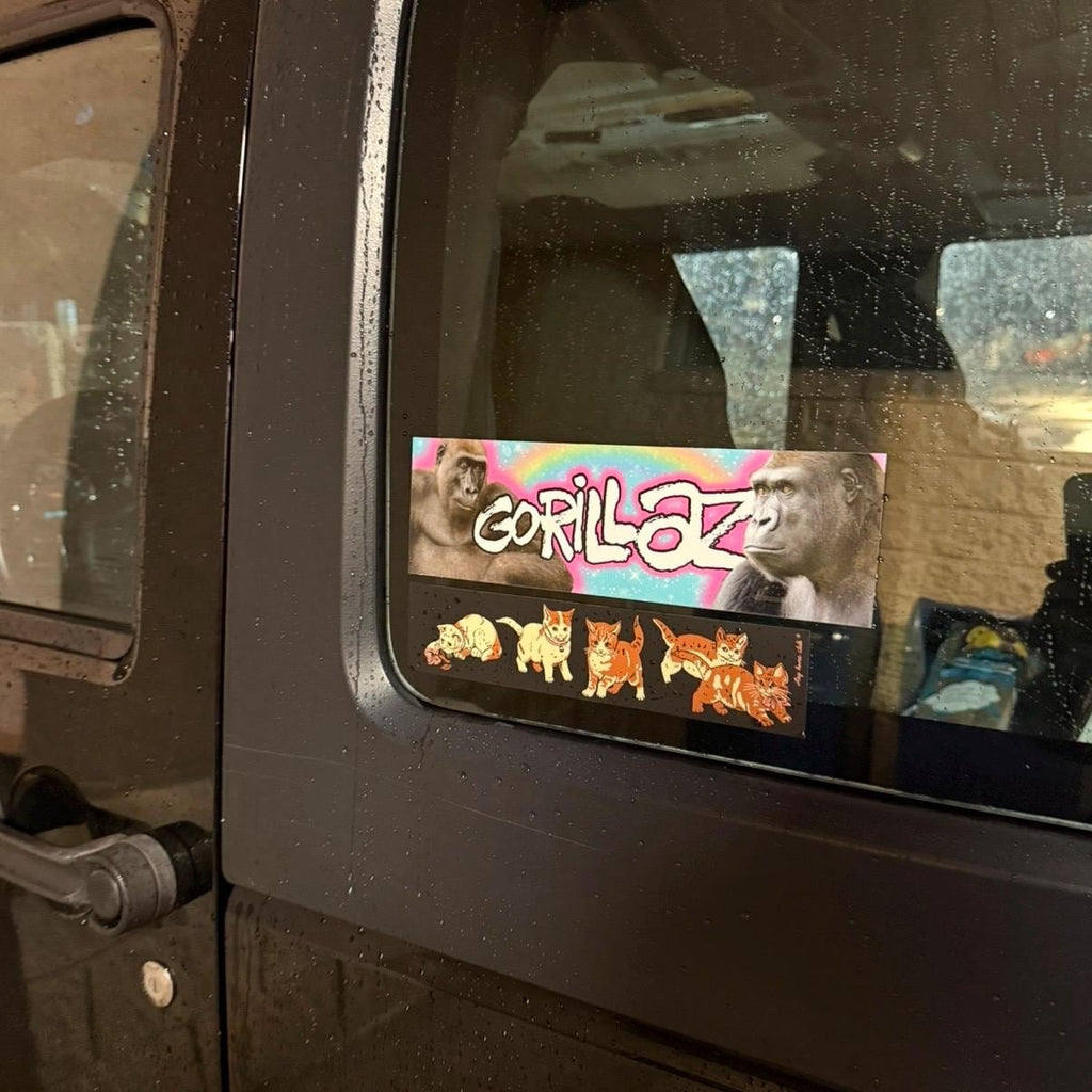 Sticker with gorilla design on a vehicle window