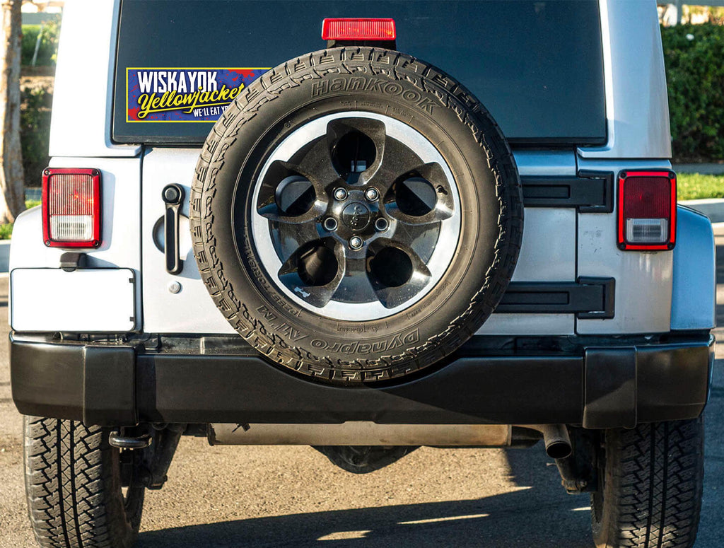 Back view of a vehicle with a spare tire mounted on the back, with yellowjackets sticker on rear window.