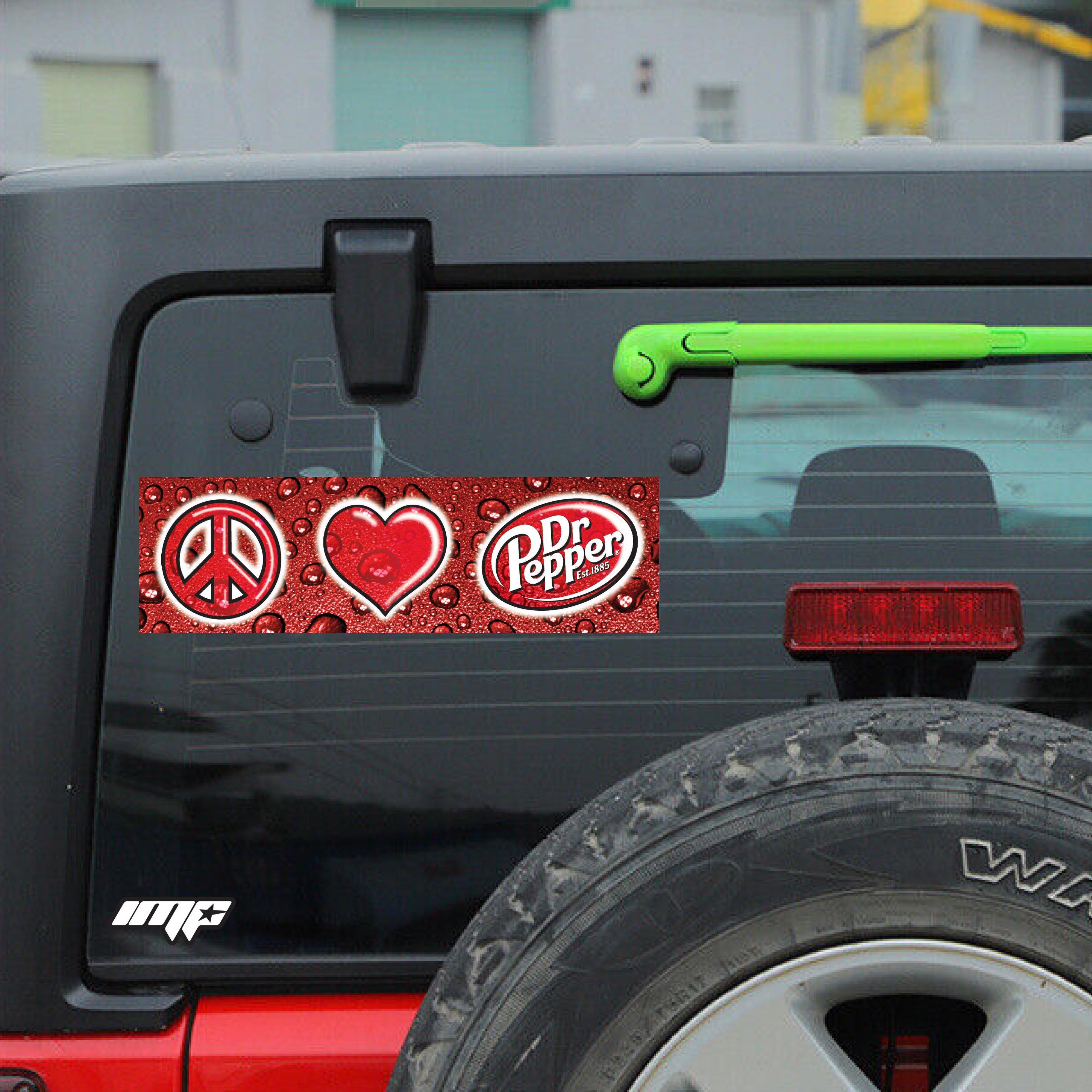 Dr Pepper logo with peace symbol and heart on a car window
