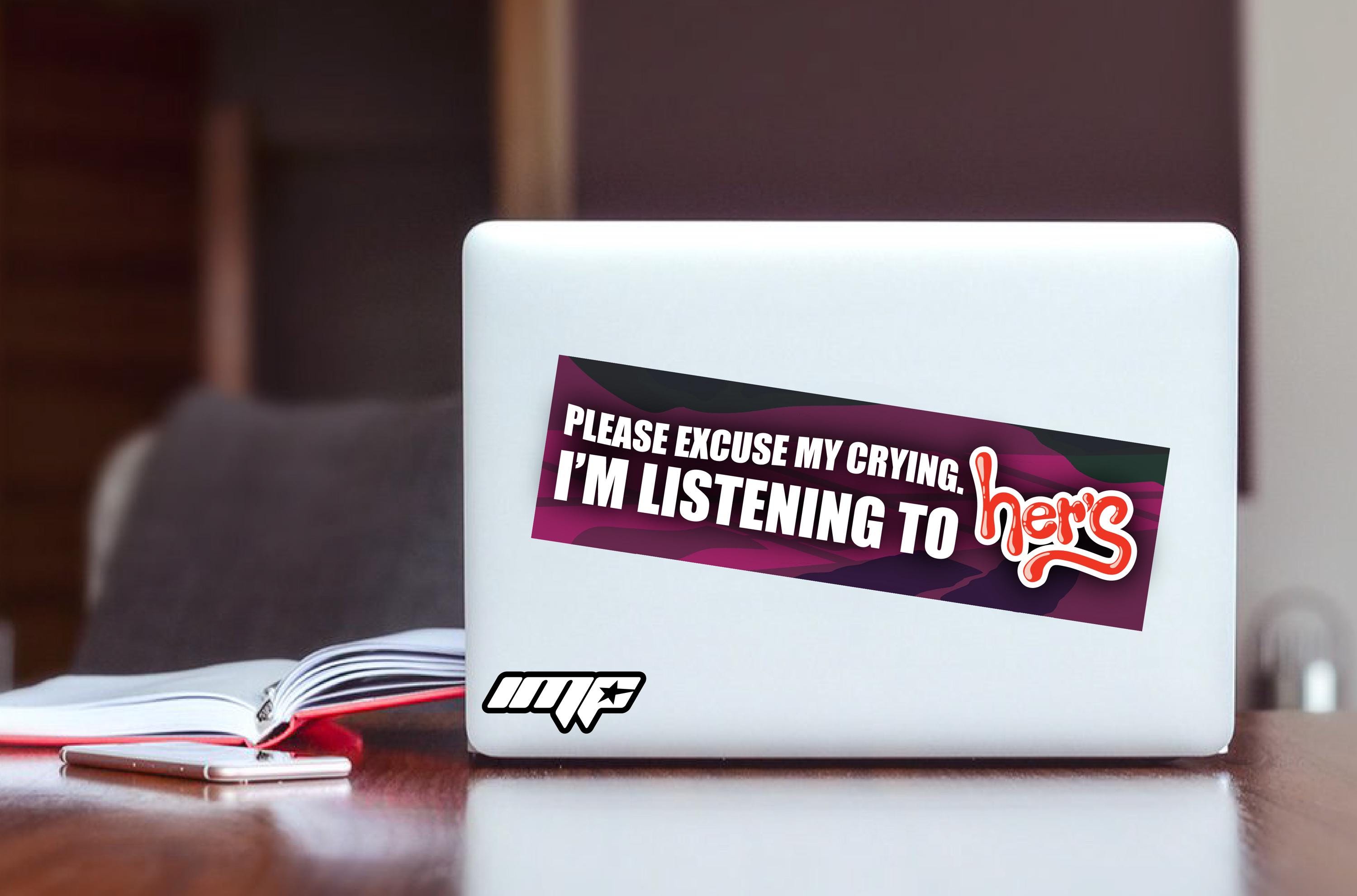 Laptop with a sticker on a desk