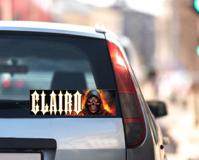 Car window with a 'Clairo' decal featuring a skull design.
