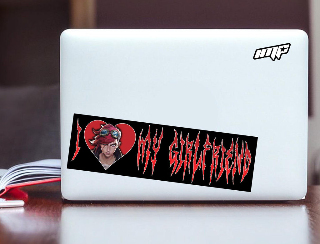 Laptop with a sticker on a desk