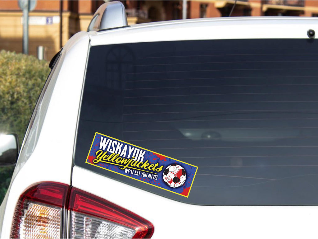 Car window with a 'Wiskayok Yellowjackets' sticker on a blurred background