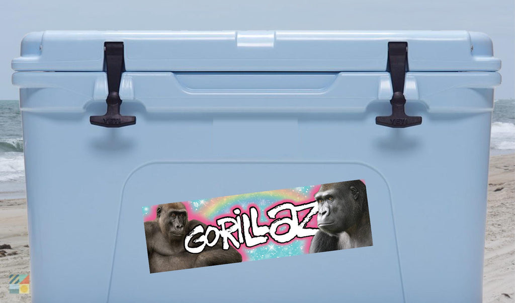 Blue cooler with Gorillaz logo on a beach
