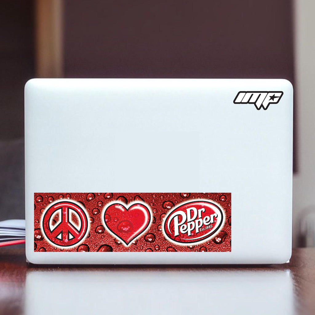White laptop with Dr Pepper logo and peace and heart symbols on a dark surface