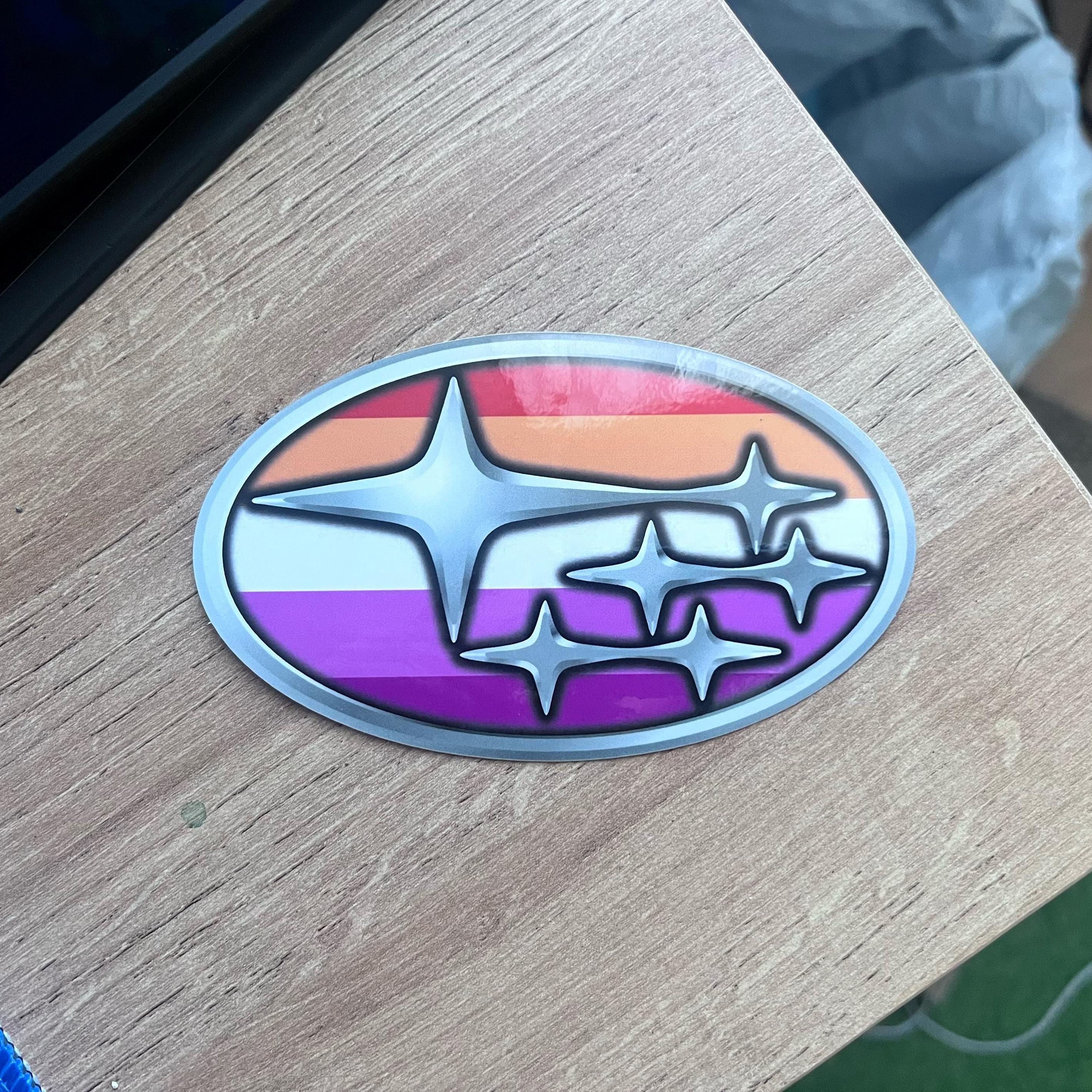 Colorful Subaru logo on a wooden surface