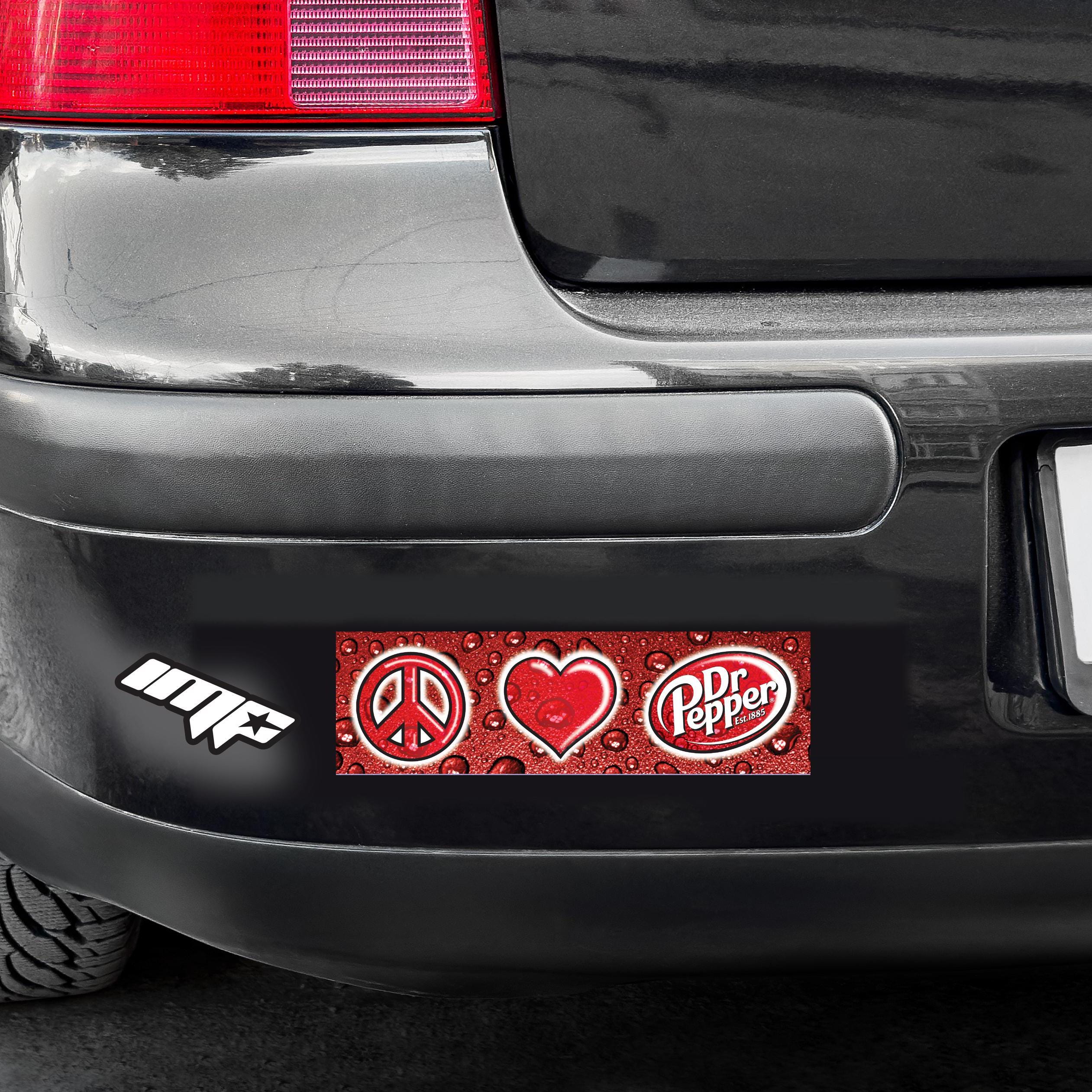 Dr Pepper bumper sticker on a car's rear window